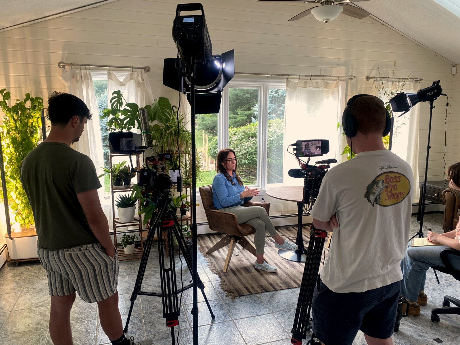 Crew lighting and filming an on-camera interview